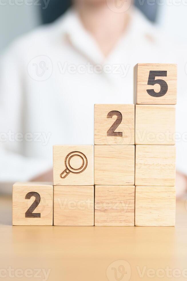 2025 year block with magnifying glass icon. SEO, Search Engine Optimization, hiring , Advertising, Idea, Strategy, marketing, Keyword, Content and New Year start concepts photo