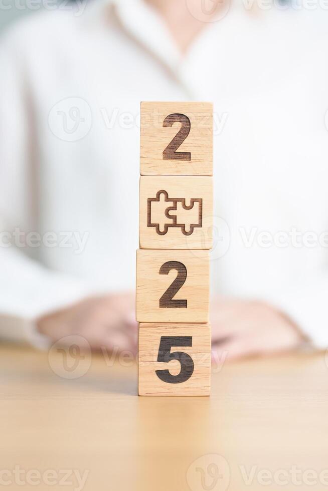 2025 block with jigsaw puzzle icon. Business Process, Team, teamwork, Goal, mission, Resolution, strategy, plan, Action, partnership, and New Year start photo