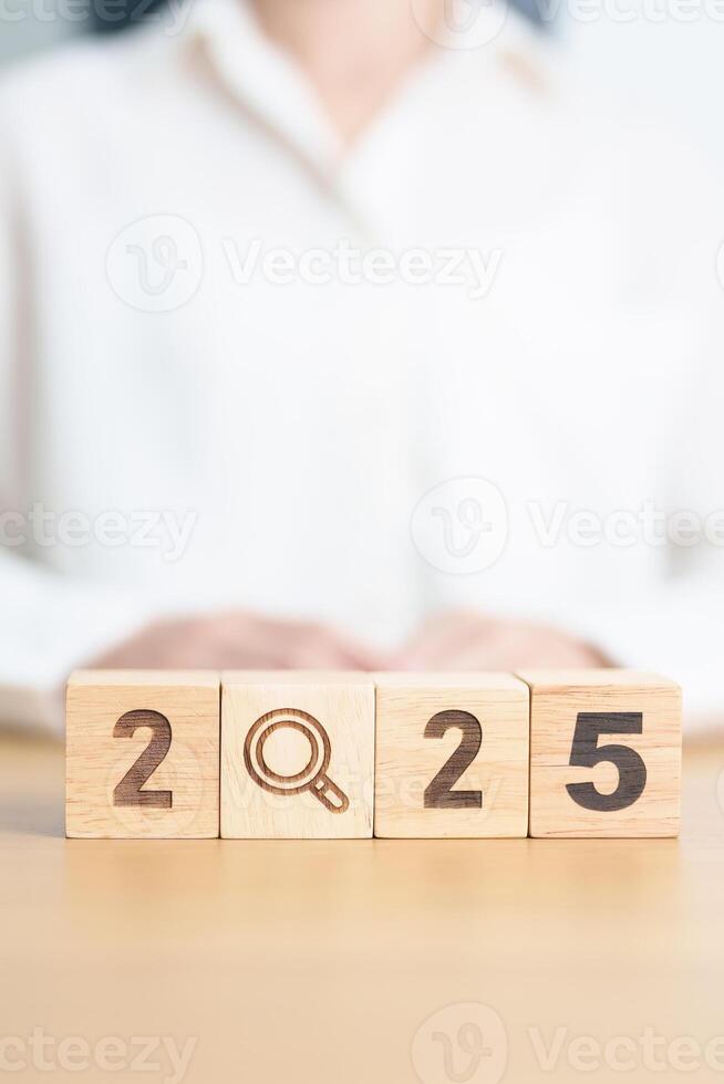 2025 block with magnifying glass icon. SEO, Search Engine Optimization, hiring , Advertising, Idea, Strategy, marketing, Keyword, Content and New Year start concepts photo