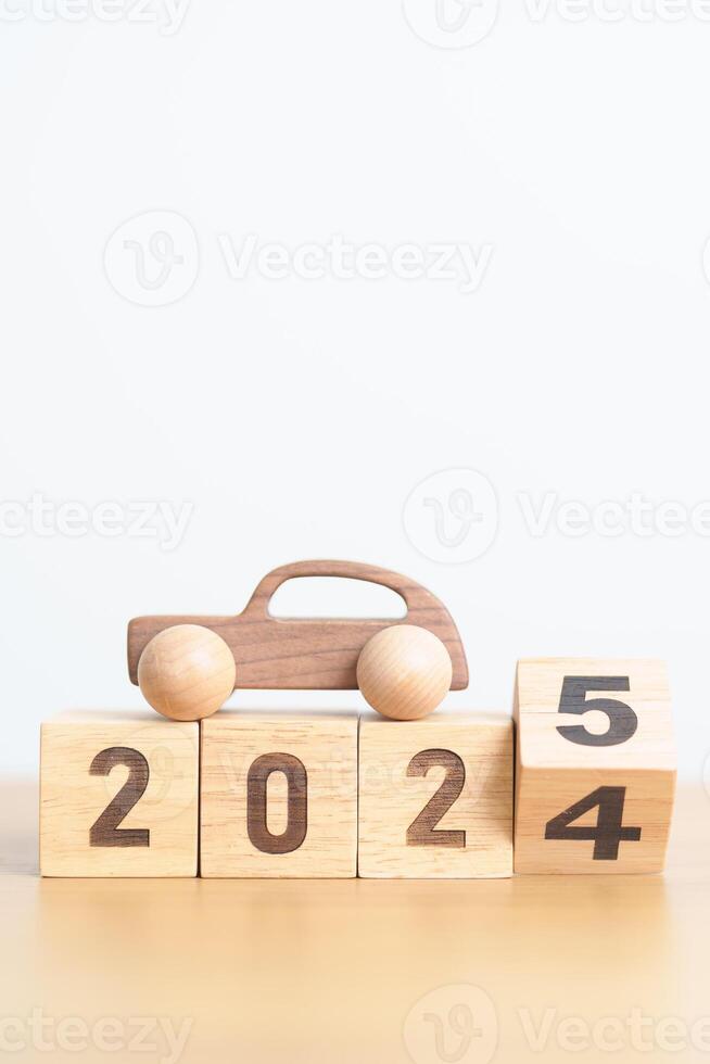 2024 end year to Happy New Year 2025 with Car model on table. Automobile Tax, Car Insurance, Financial, vehicle Repair and Maintenance and New Year concept photo