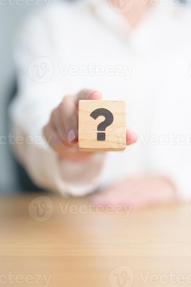 Wood block of Questions Mark sign. FAQ, frequency asked questions, Answer, Q and A, Information, Communication and interrogation Concepts photo