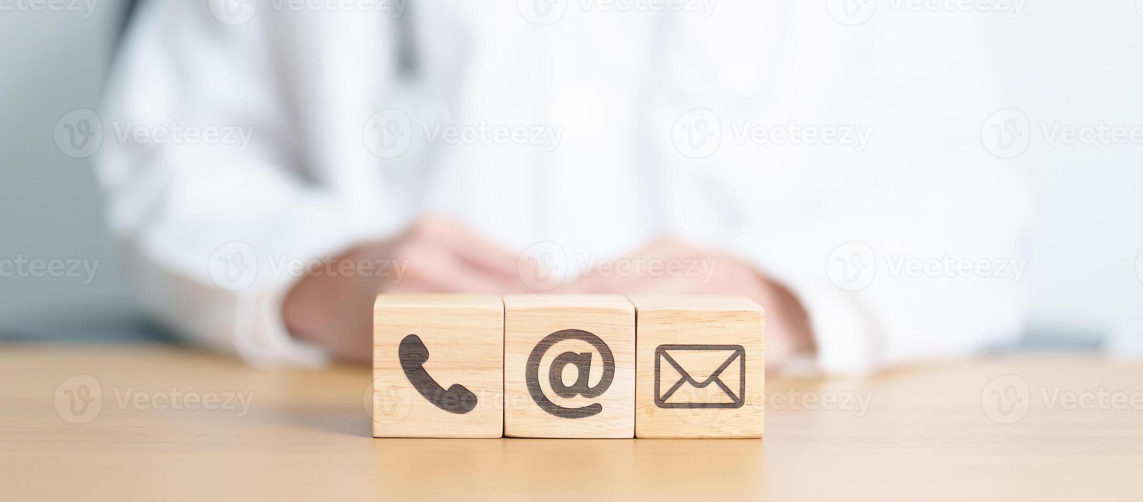 Contact Us concepts. Wood block of Email, call Phone and Website Address sign against Doctor background. Healthcare Customer support hotline, business Marketing, health, communication and Advertising photo