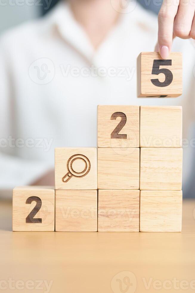 2025 year block with magnifying glass icon. SEO, Search Engine Optimization, hiring , Advertising, Idea, Strategy, marketing, Keyword, Content and New Year start concepts photo