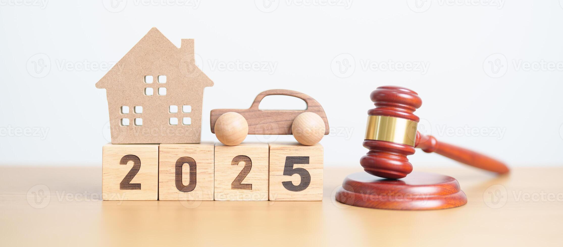 Happy New Year 2025 with house and Car model and gavel justice hammer on desk in courthouse. Real Estate and Car Law, Home Insurance, property Tax, Auction and Bidding concepts photo
