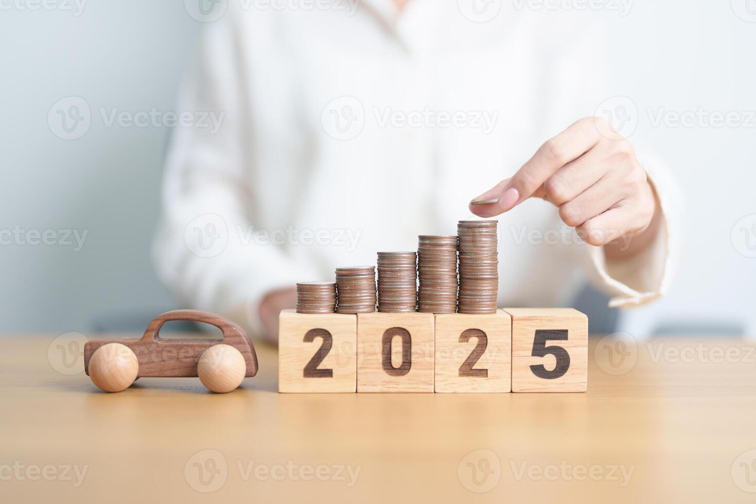 Happy New Year 2025 with car model and Coins Money stack for deposit and Automobile Tax. Money Saving, Car Insurance, Financial, vehicle Repair and Maintenance and New Year concept photo
