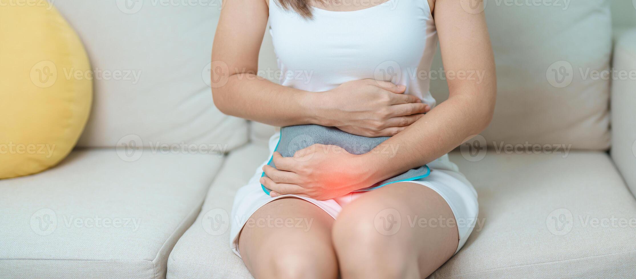 Menstruation period cycle of monthly and Stomachache concepts. woman having abdomen pain and menstrual ache with hot water bottle, illness female suffer from premenstrual ache and body Health problem photo