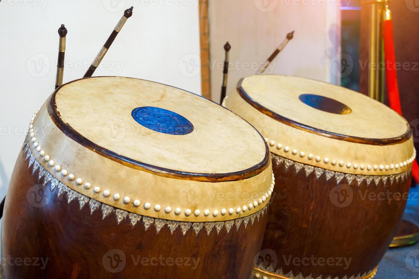 Glong thad is a Thai drum. It is a large double-sided drum with 2 balls, one making a high sound and the other making a low sound. Used to play in the Piphat band, playing with Tapone. photo