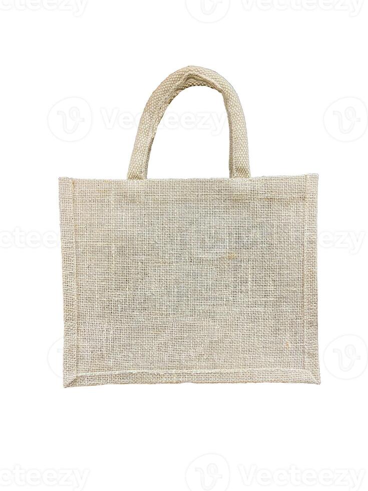 Cloth bag with handle from hemp sack on white background. Concept to reduce global warming, reduce plastic waste, zero waste. Soft and selective focus. photo