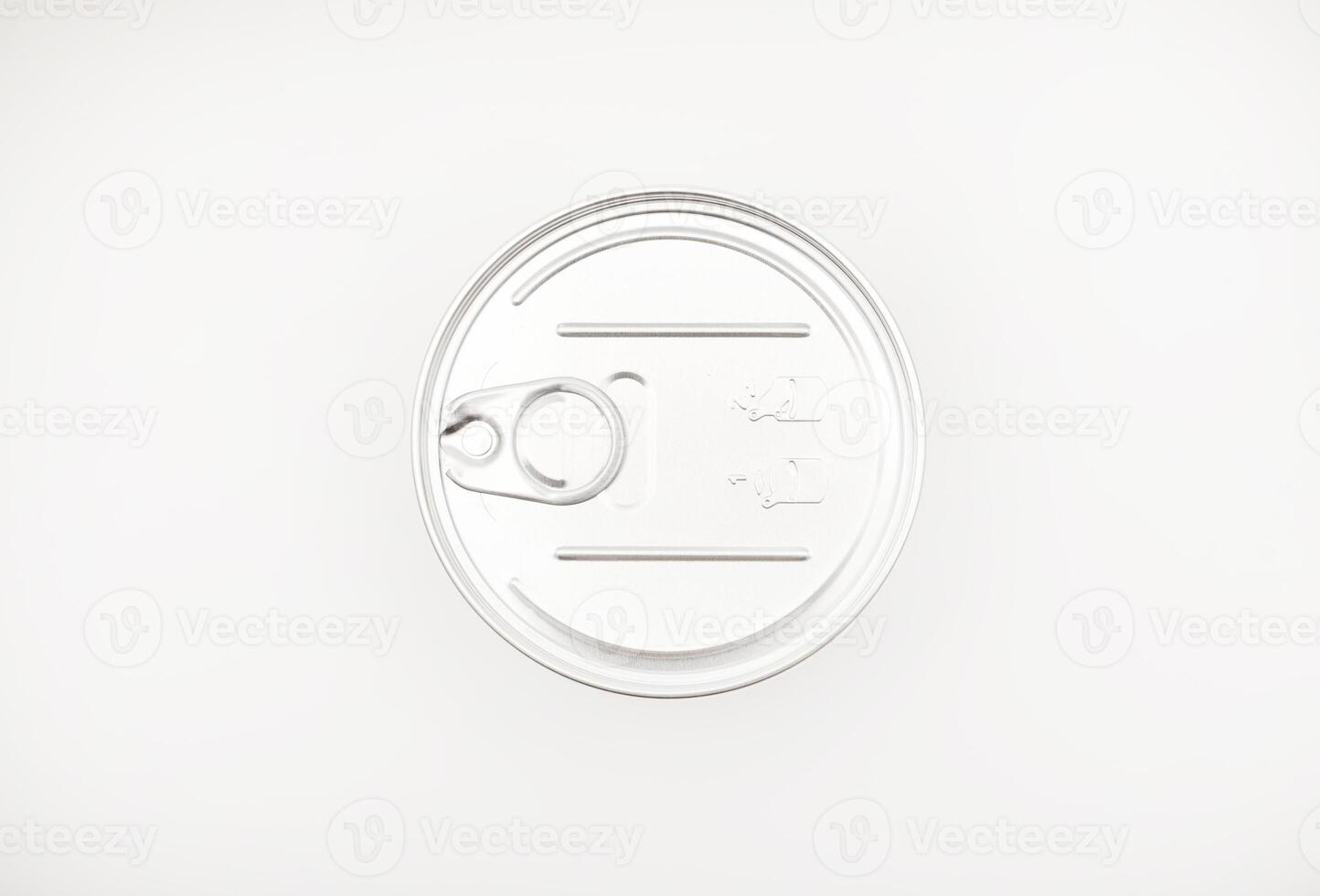Shiny lid of a tin can on a white background. photo