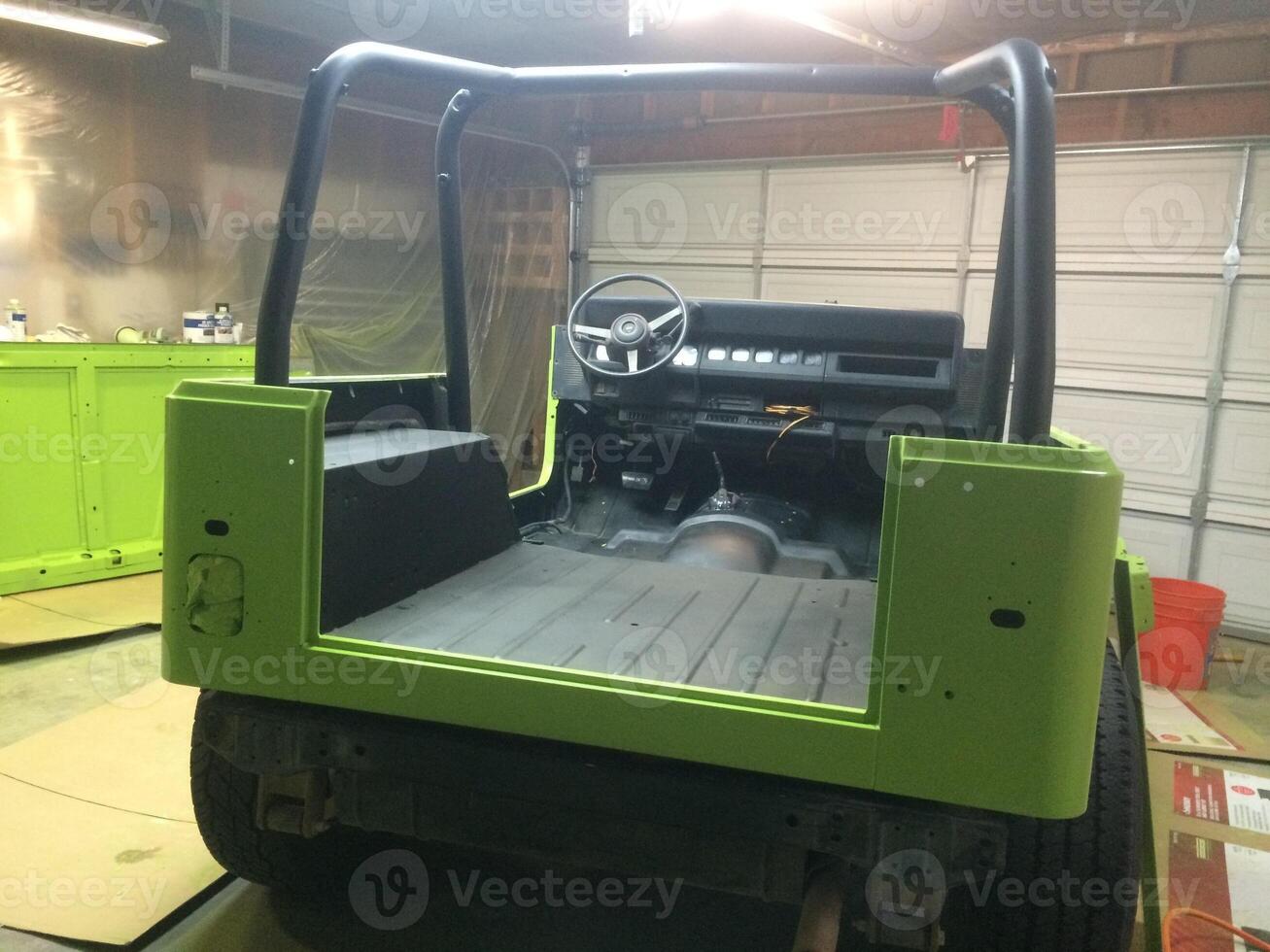 Working on Lime Green Paint Job, 1990s 4x4 Vehicle photo