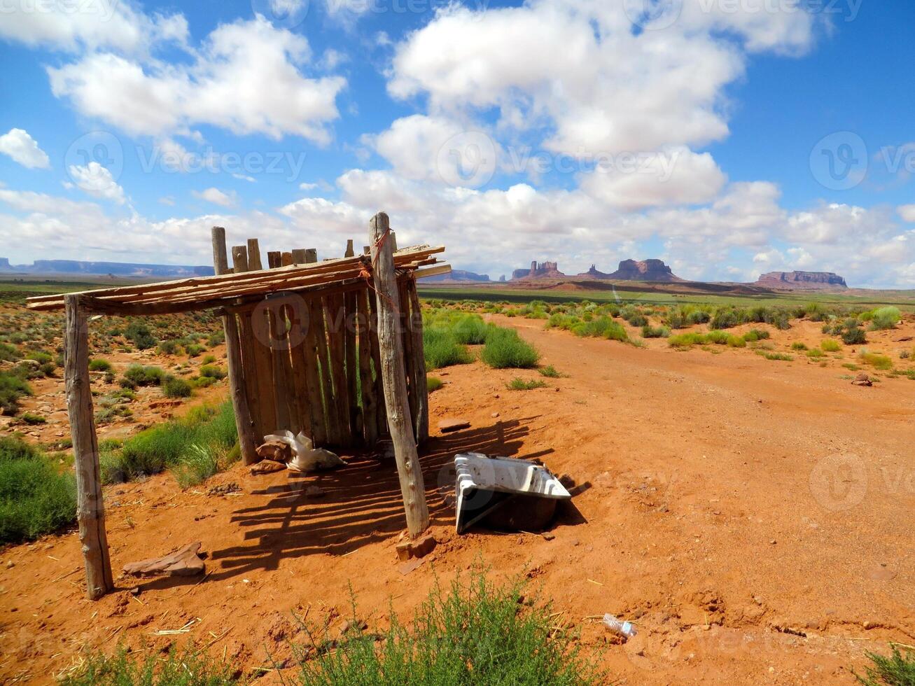 Dirt Road with Wood Shelter and Bathtub in Desert Southwest near Monument Valley photo