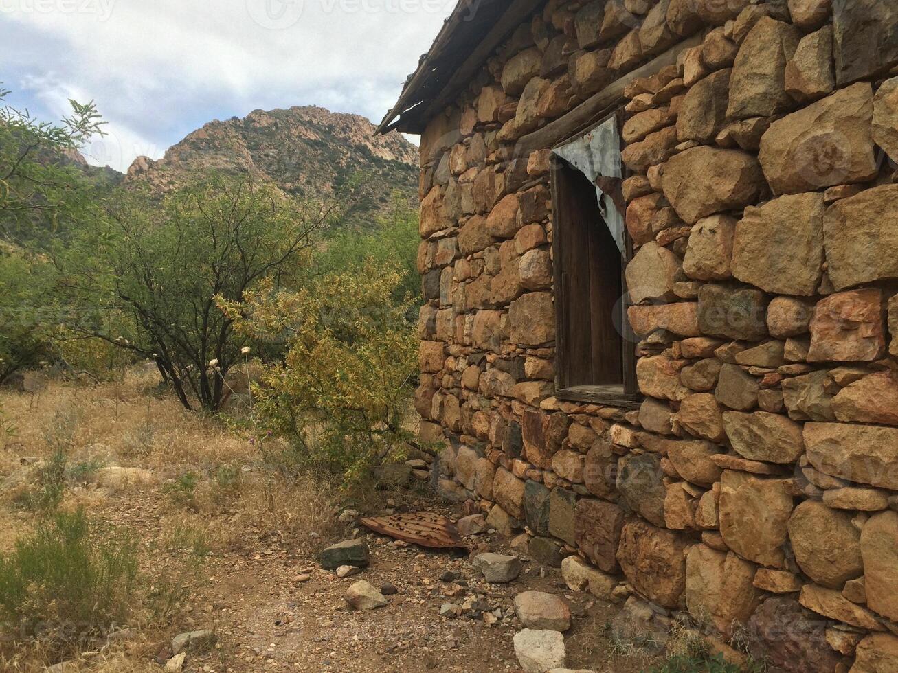 An Abandoned Stone Cabin in Arizona Desert photo