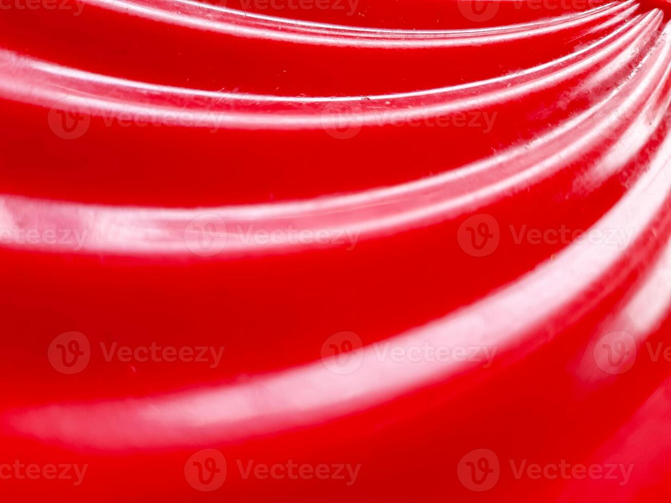 Glossy abstract background with red color. defocused and close up of red plastic tube texture for abstract background and design. photo