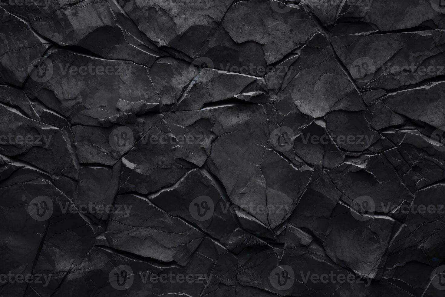 black rock face background of rugged stone texture pattern photo