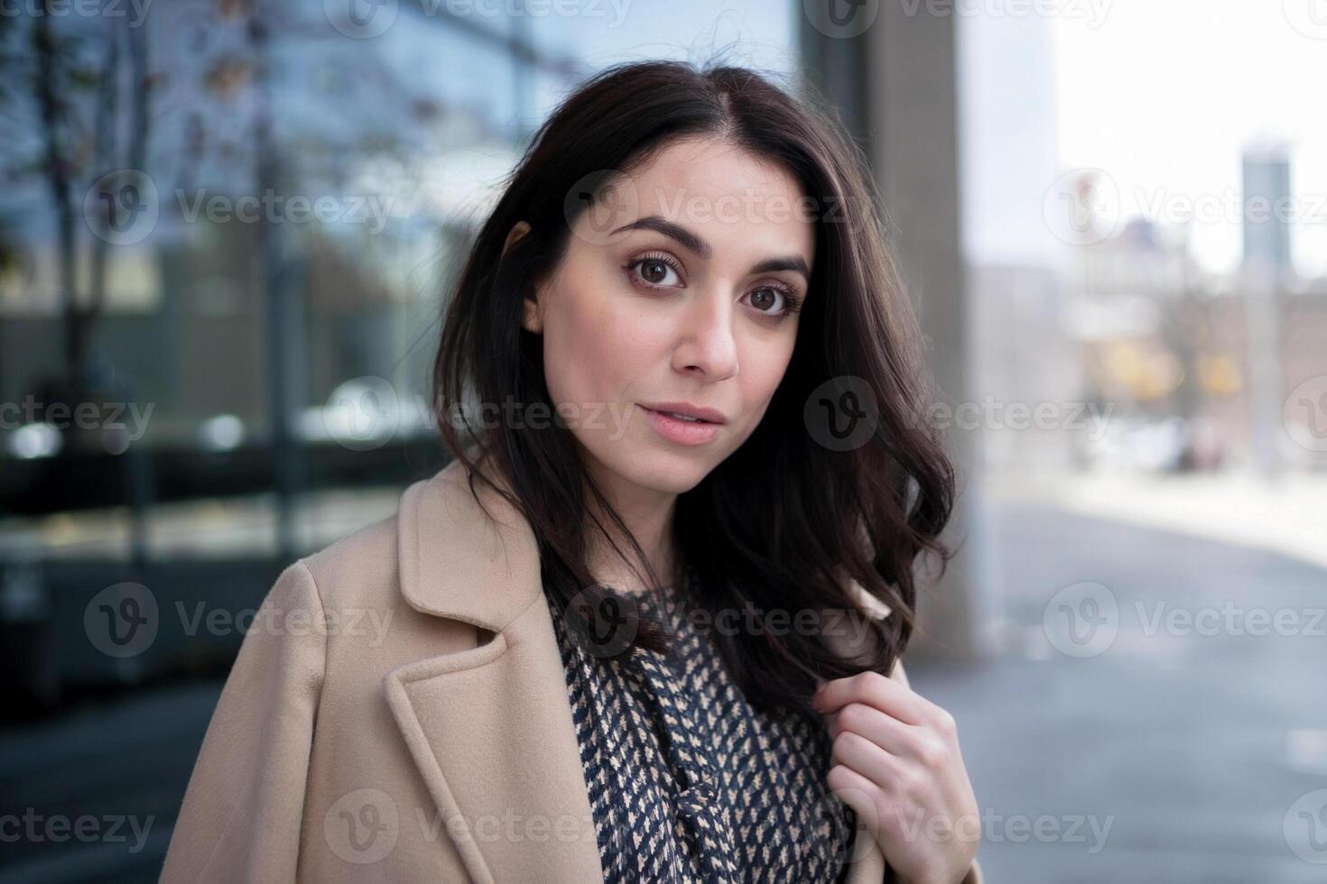 candid street portrait of mid adult woman in the city photo