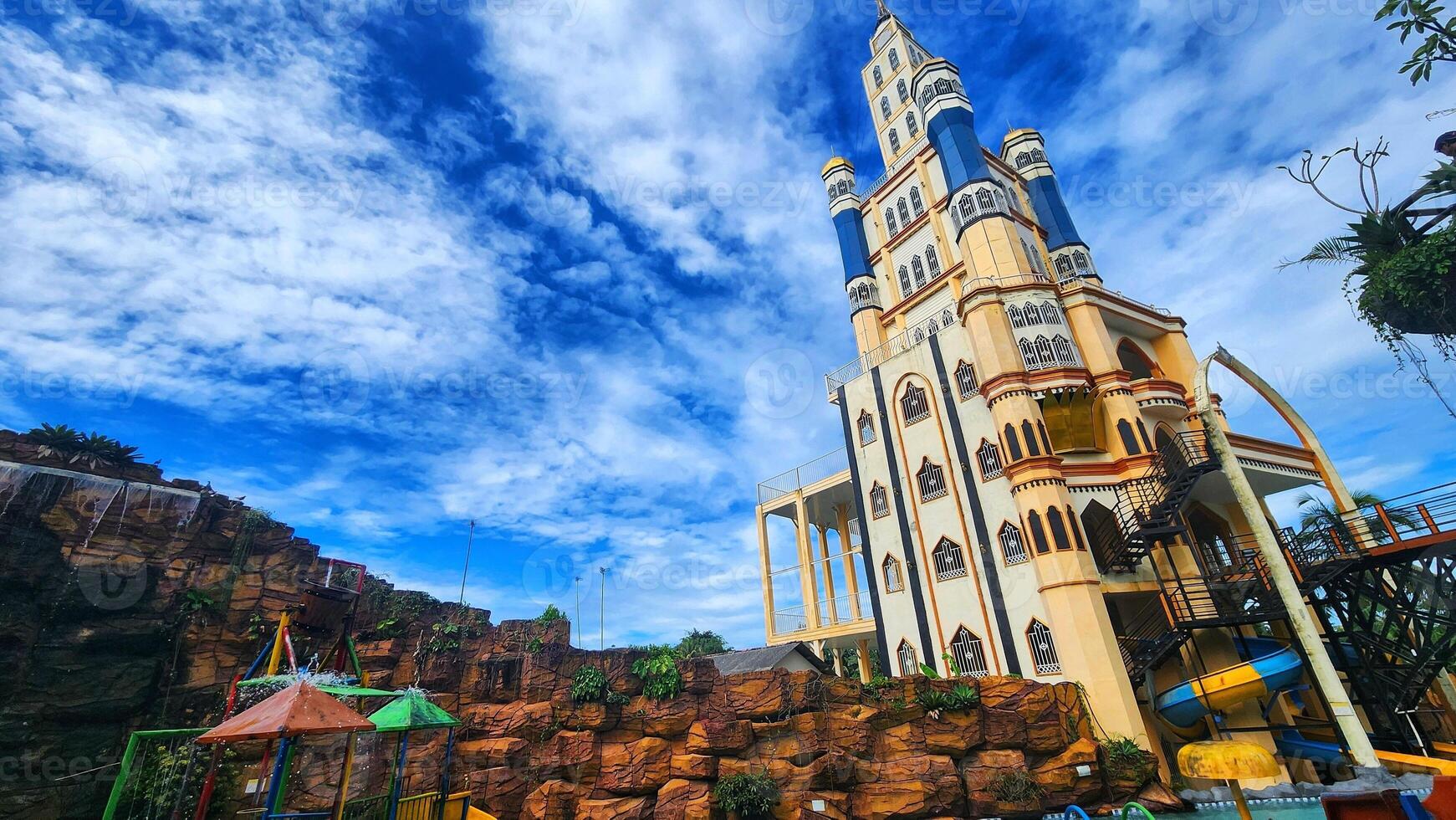 a large tower with a clock on top of it photo