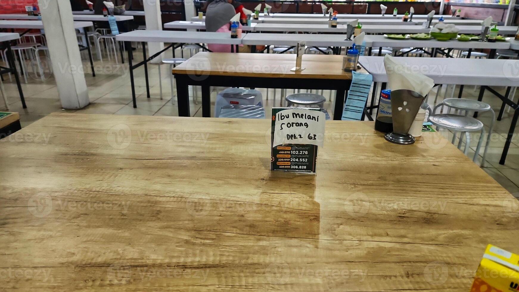 a table with a bottle of ketchup on it photo