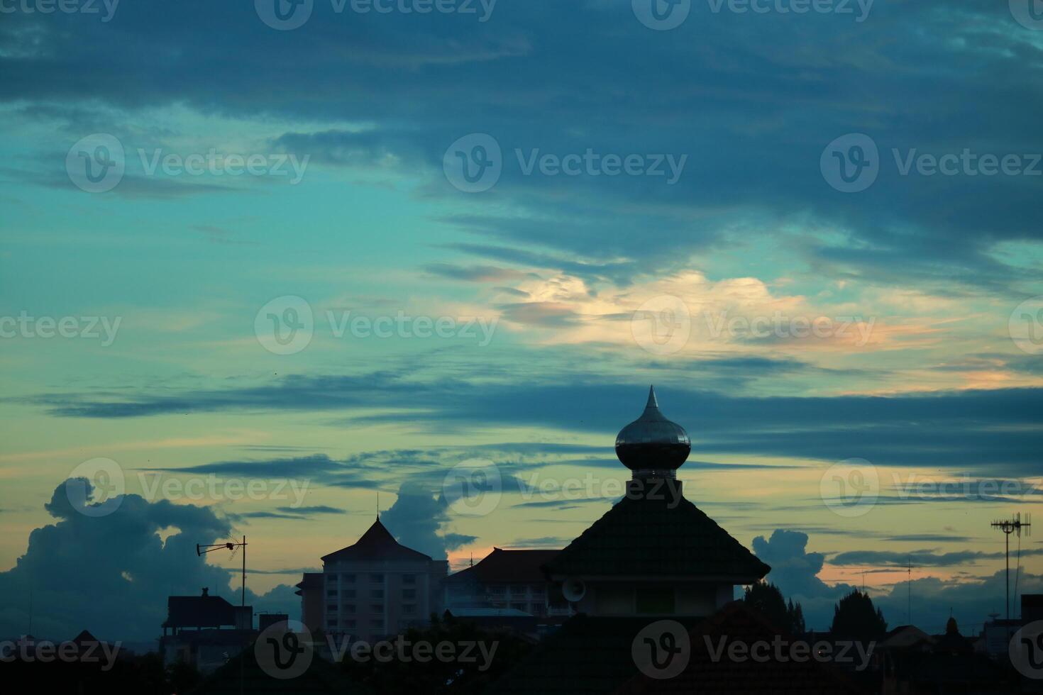 a view of the sky with clouds and buildings photo