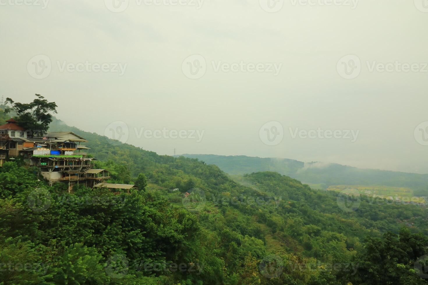 a view of a house on a hillside photo