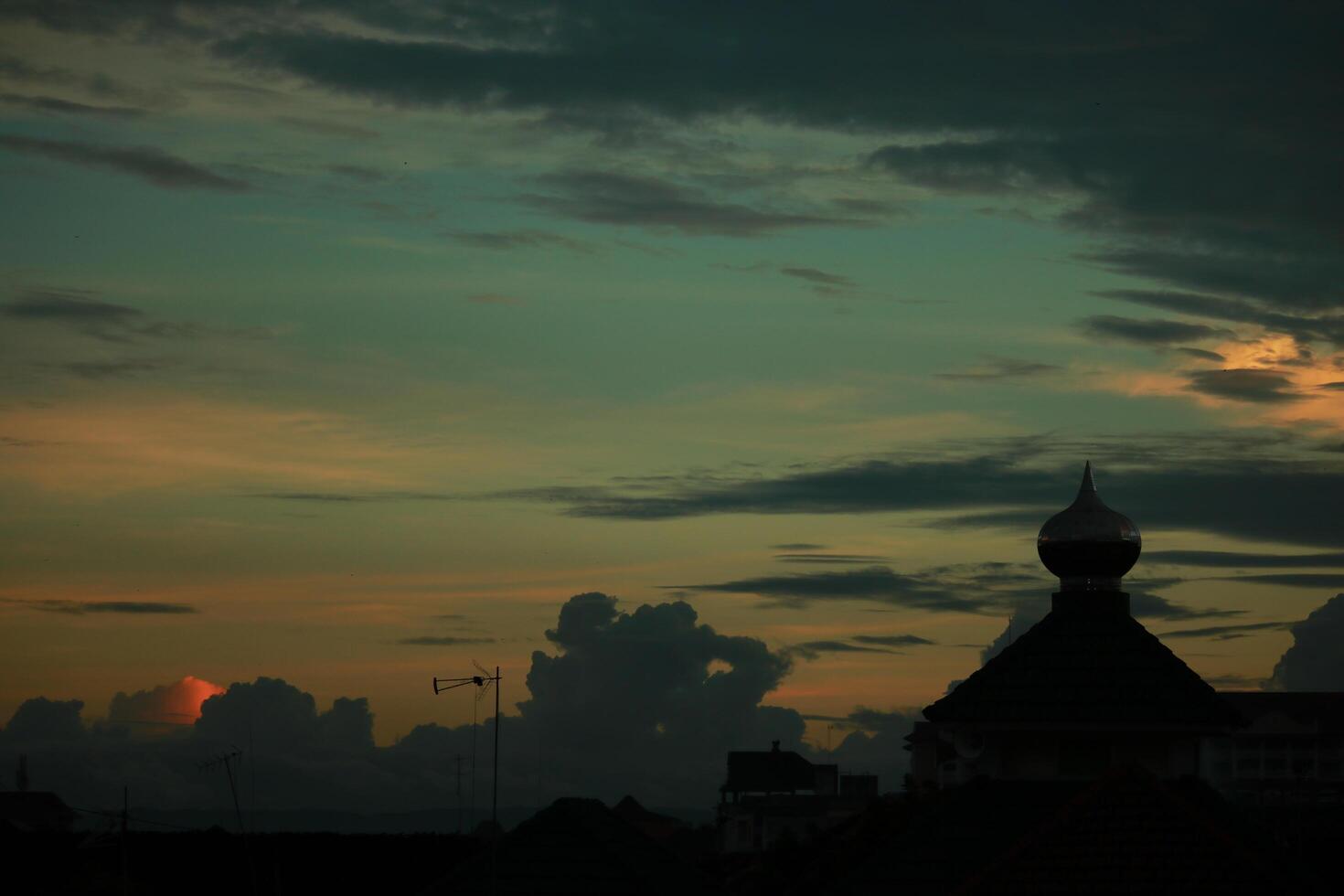 a view of the sunset from the roof of a building photo