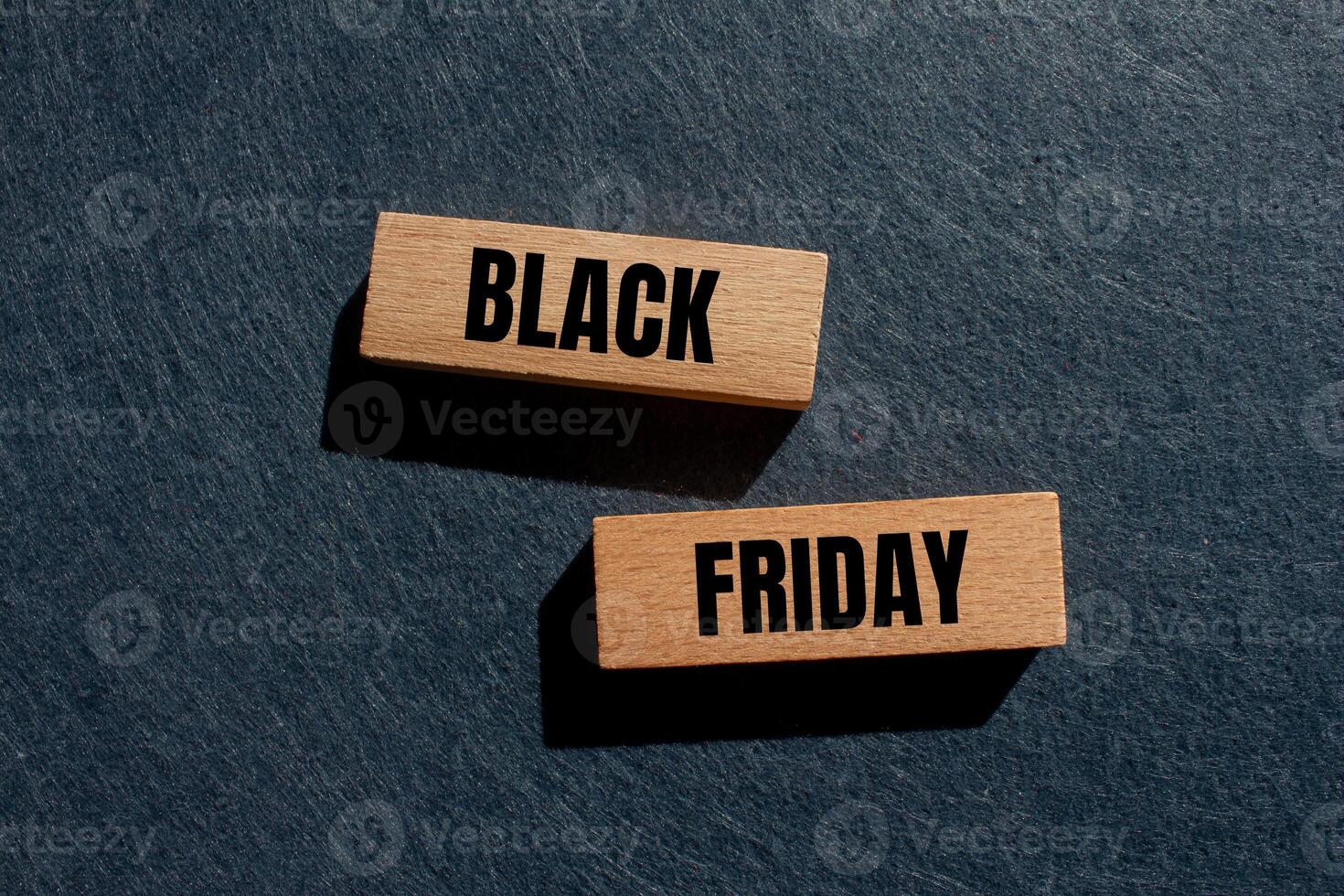 Black friday message written on wooden blocks with gray background. Conceptual black friday symbol. Copy space. photo