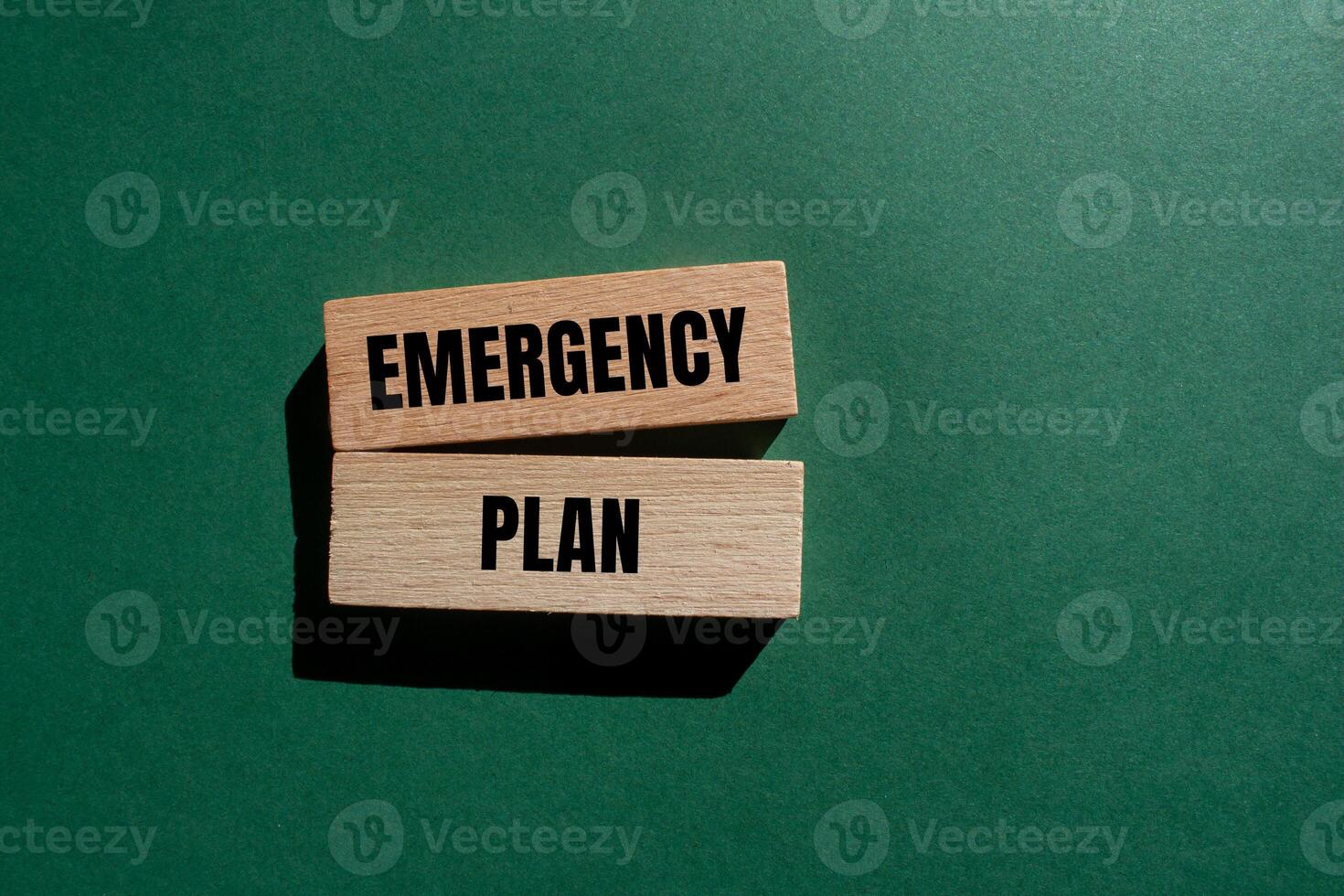 Emergency plan message written on wooden blocks with green background. Conceptual emergency plan symbol. Copy space. photo