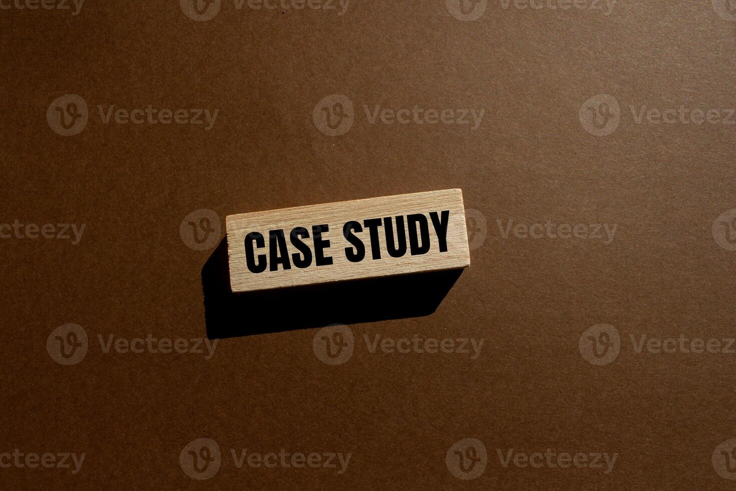 Case study message written on wooden block with brown background. Conceptual case study symbol. Copy space. photo