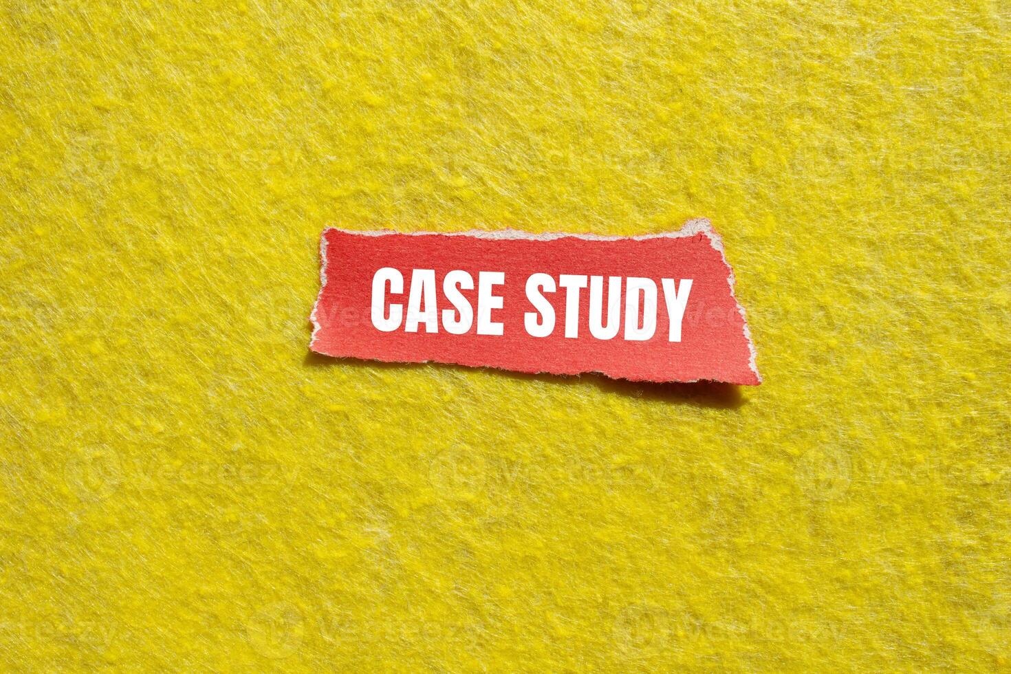 Case study message written on ripped torn red paper piece with yellow background. Conceptual case study symbol. Copy space. photo