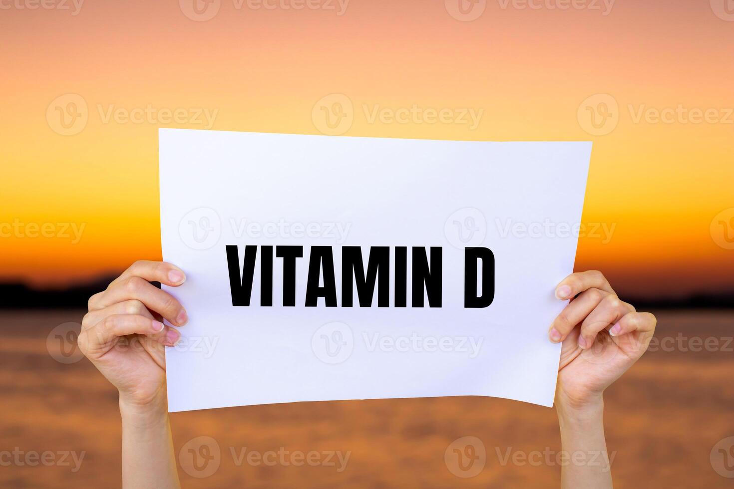 Vitamin d message written on white paper with blurry lake background. Conceptual vitamin d symbol. Copy space. photo
