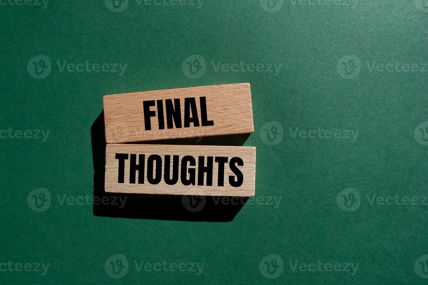 Final thoughts message written on wooden blocks with green background. Conceptual final thoughts symbol. Copy space. photo