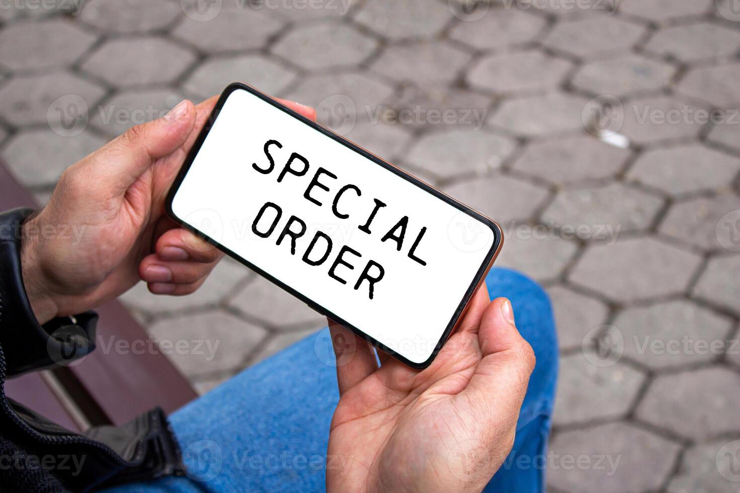 Special order message written on smartphone screen. Conceptual special order symbol. Copy space. photo