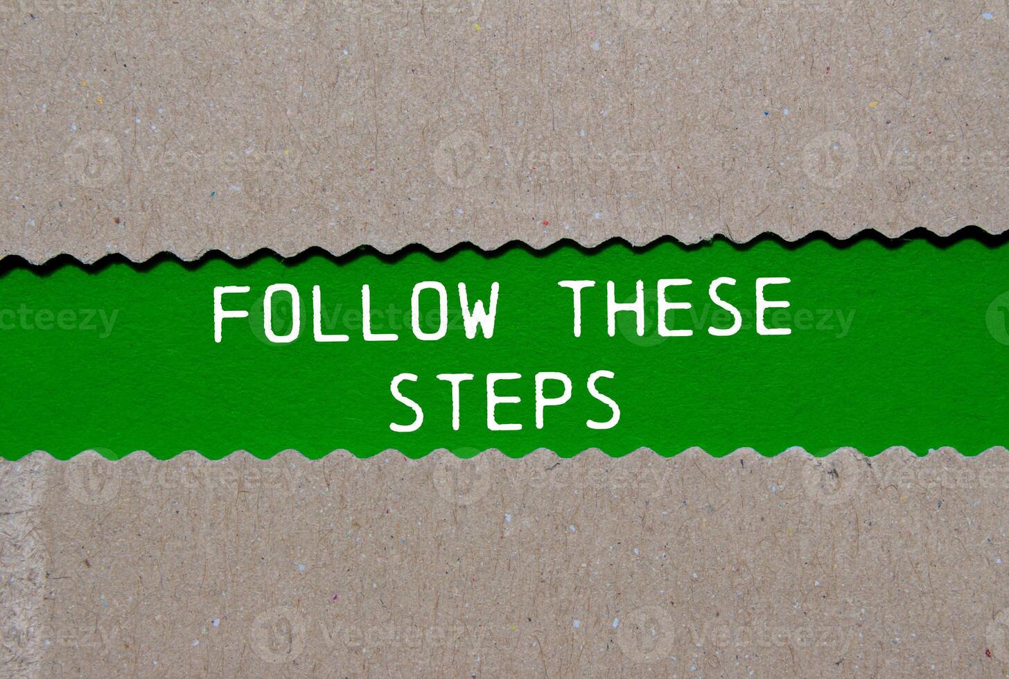Follow these steps message written on ripped torn paper on green background. Conceptual follow these steps symbol. Copy space. photo
