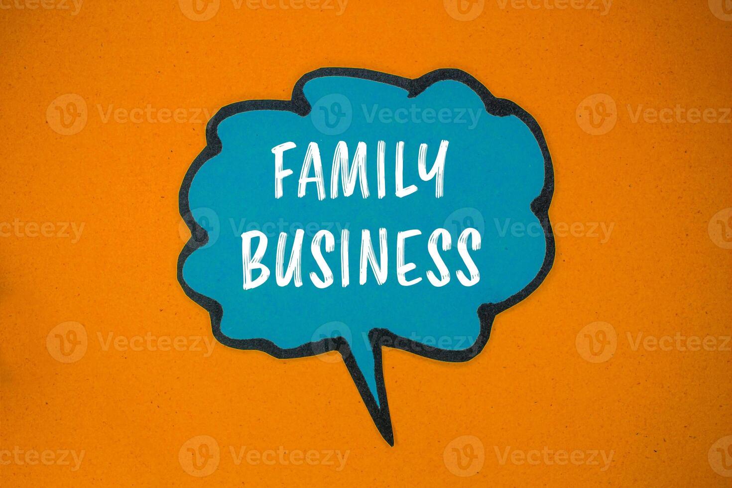 Family business message written on blue paper speech bubble with orange background. Conceptual family business symbol. Copy space. photo