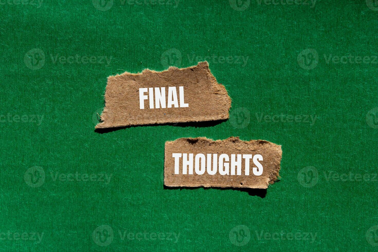 Final thoughts message written on ripped torn paper pieces with green background. Conceptual final thoughts symbol. Copy space. photo