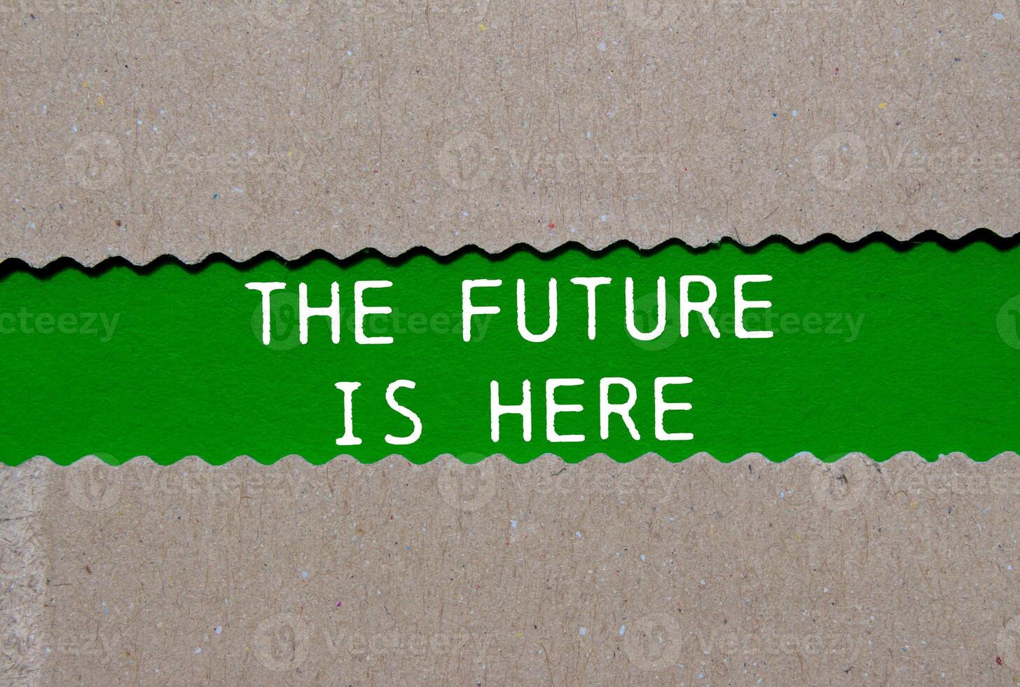 The future is here message written on ripped torn paper on green background. Conceptual the future is here symbol. Copy space. photo