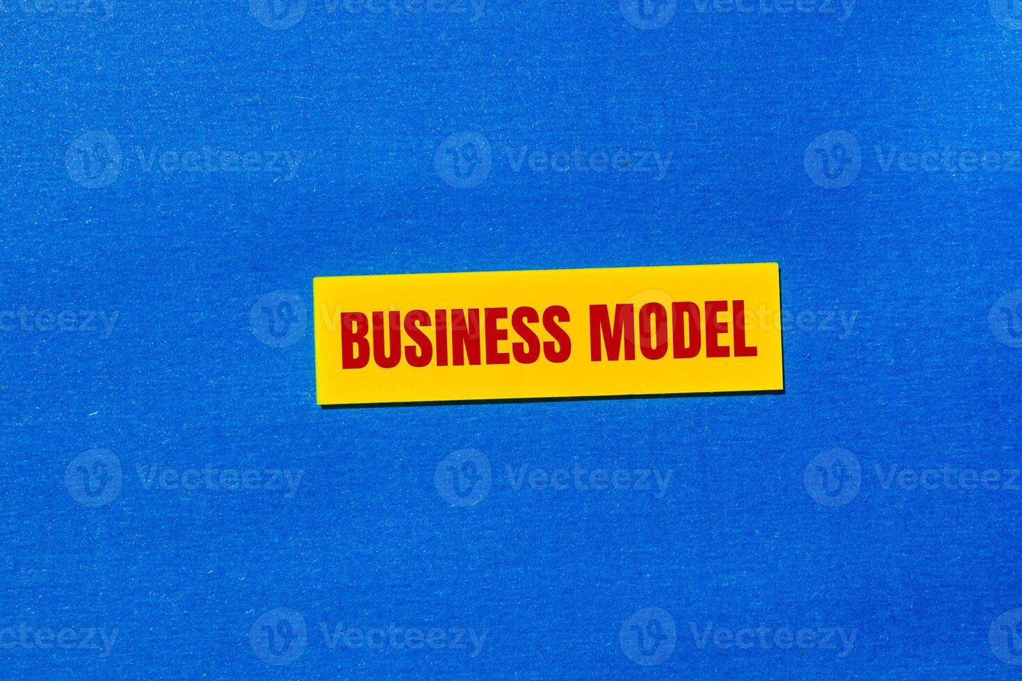Business model message written on yellow sticker with blue background. Conceptual business model symbol. Copy space. photo