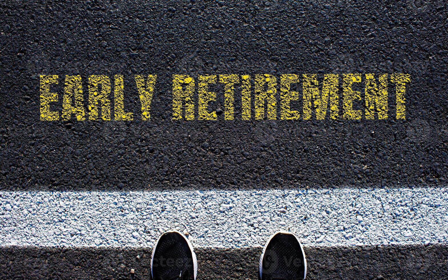 Early retirement message written on asphalt road. Conceptual early retirement symbol. Copy space. photo