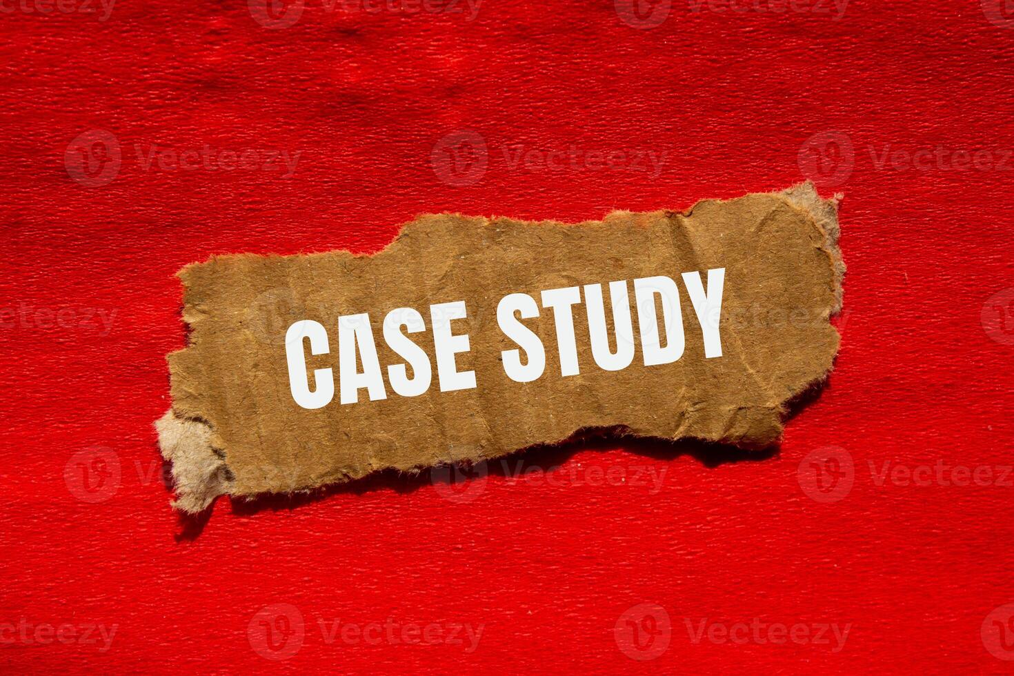Case study message written on ripped torn cardbaord paper piece with red background. Conceptual case study symbol. Copy space. photo