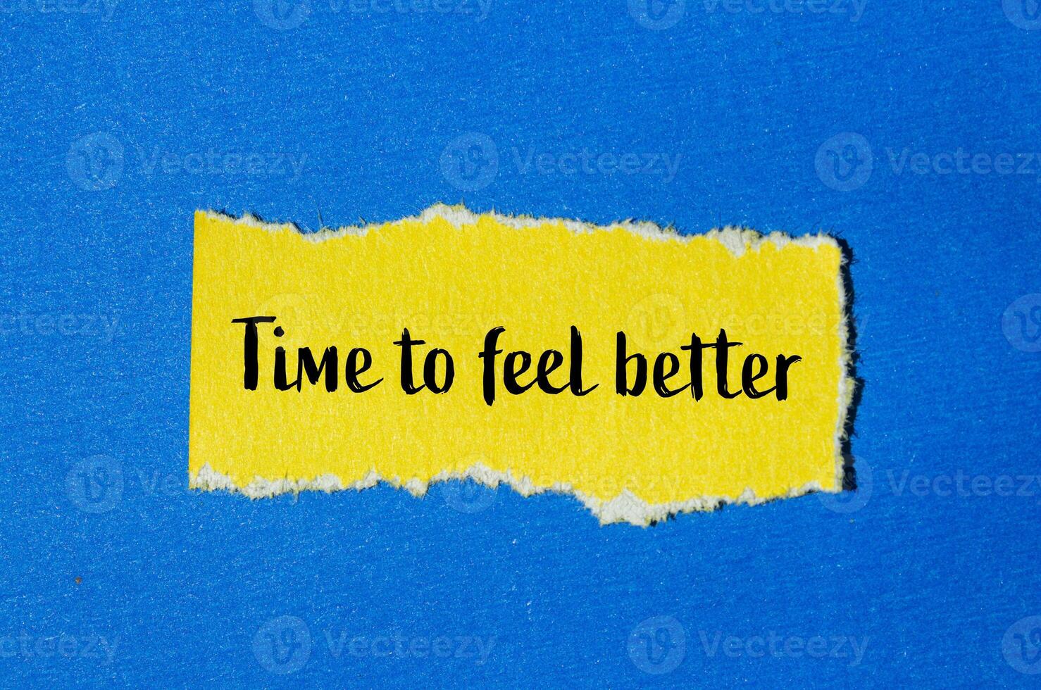 Time to feel better message written on ripped yellow torn paper piece with blue background. Conceptual time to feel better symbol. Copy space. photo