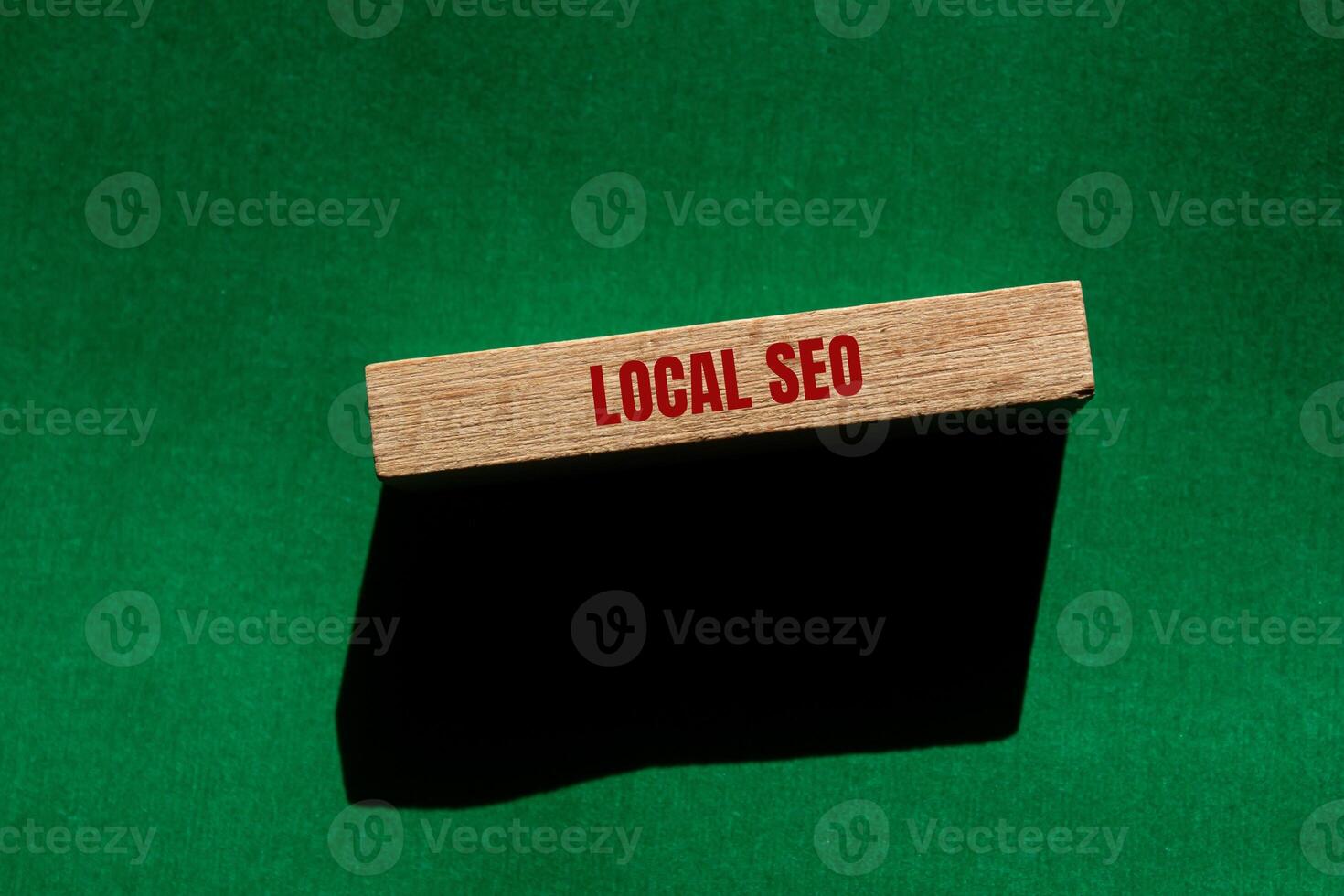Local seo message written on wooden block with green background. Conceptual local seo symbol. Copy space. photo