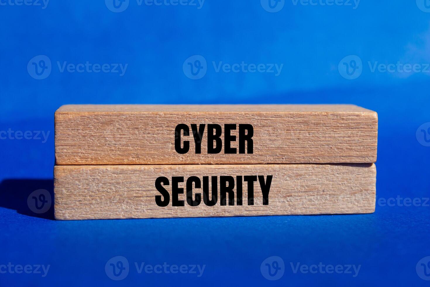 Cyber security message written on wooden blocks with blue background. Conceptual cyber security symbol. Copy space. photo