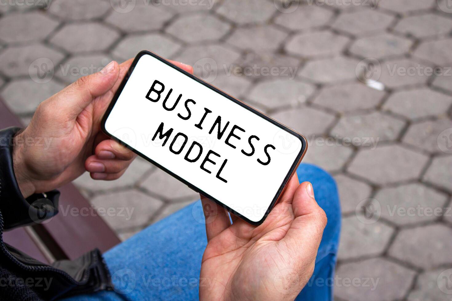 Business model message written on smartphone screen. Conceptual business model symbol. Copy space. photo