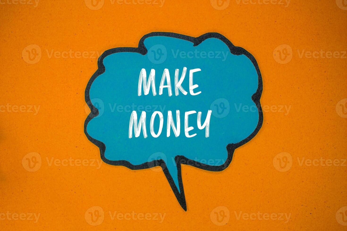 Make money message written on blue paper speech bubble with orange background. Conceptual make money symbol. Copy space. photo