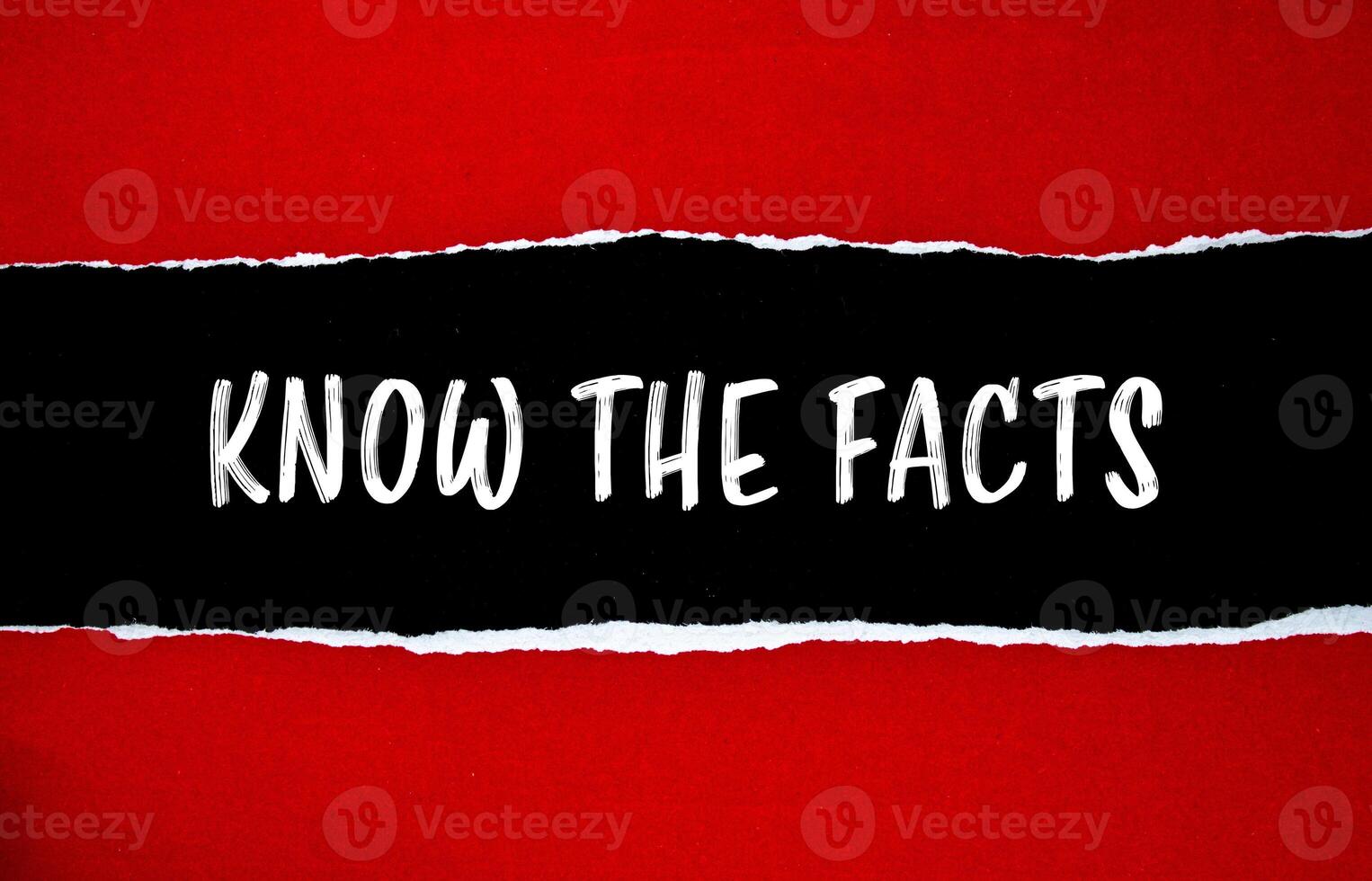 Know the facts message written on ripped torn red paper with black background. Conceptual know the facts symbol. Copy space. photo