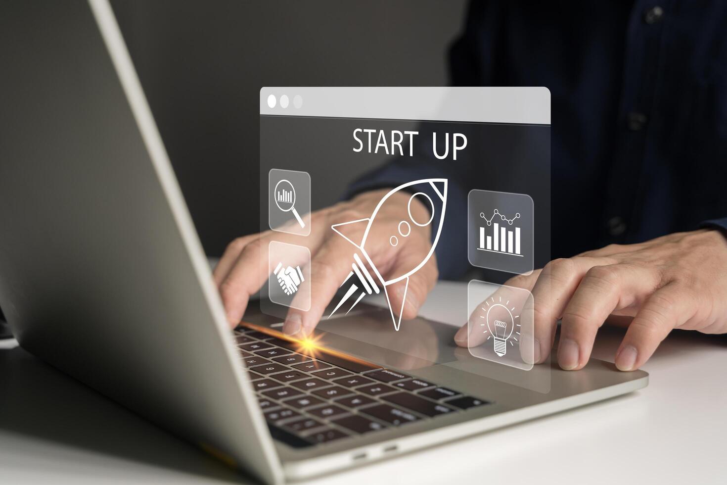 Startup business concept. Strategic planning and business success. Businessman use tablet with startup icon. photo
