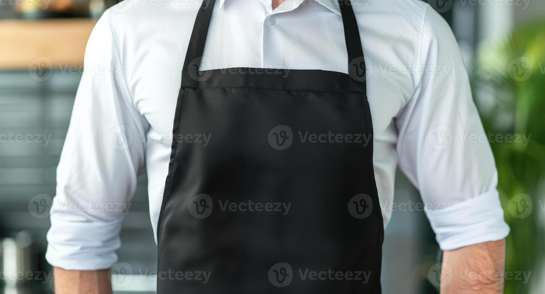 Man wearing black apron mock up in the modern kitchen, chef uniform for cooking photo
