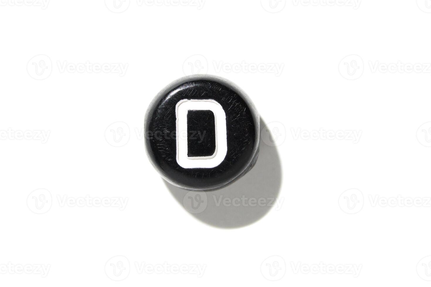 Close-up of vintage typewriter key with shadow on white background. photo