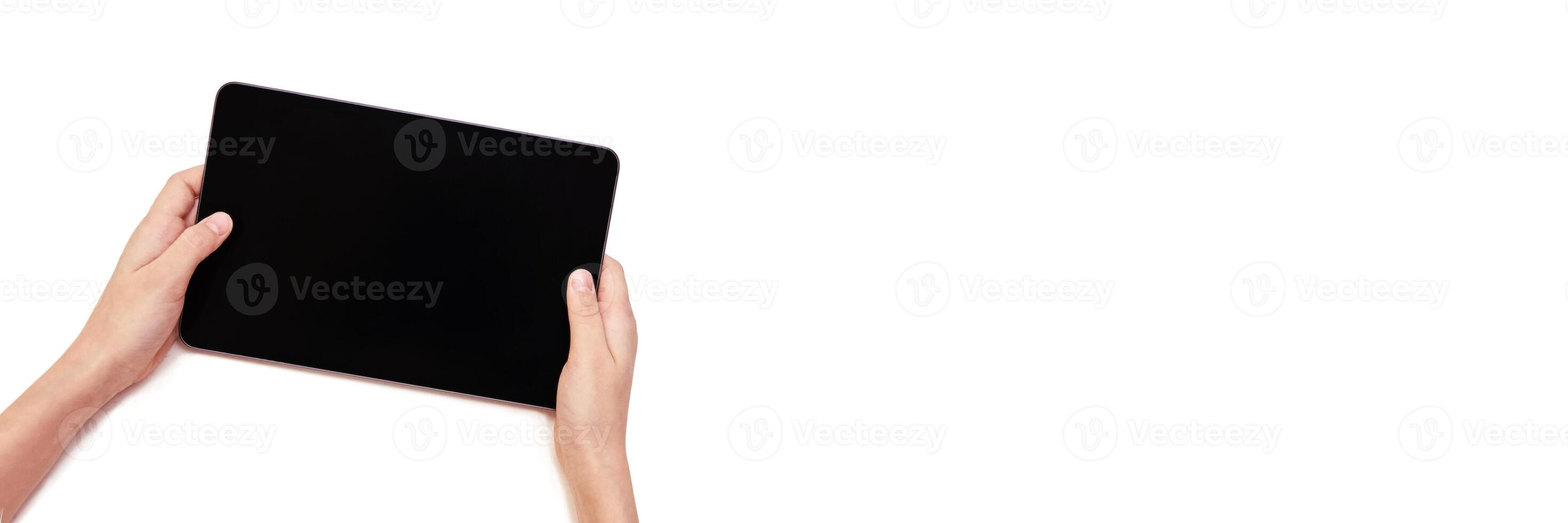 Minimalist technology concept. hands holding a tablet with blank screen for app design or presentation mockup. Horizontal banner photo