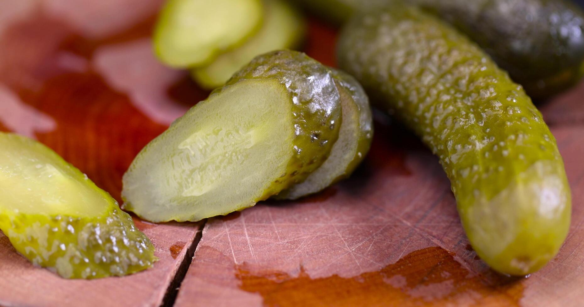 green cucumbers pickled in vinegar photo