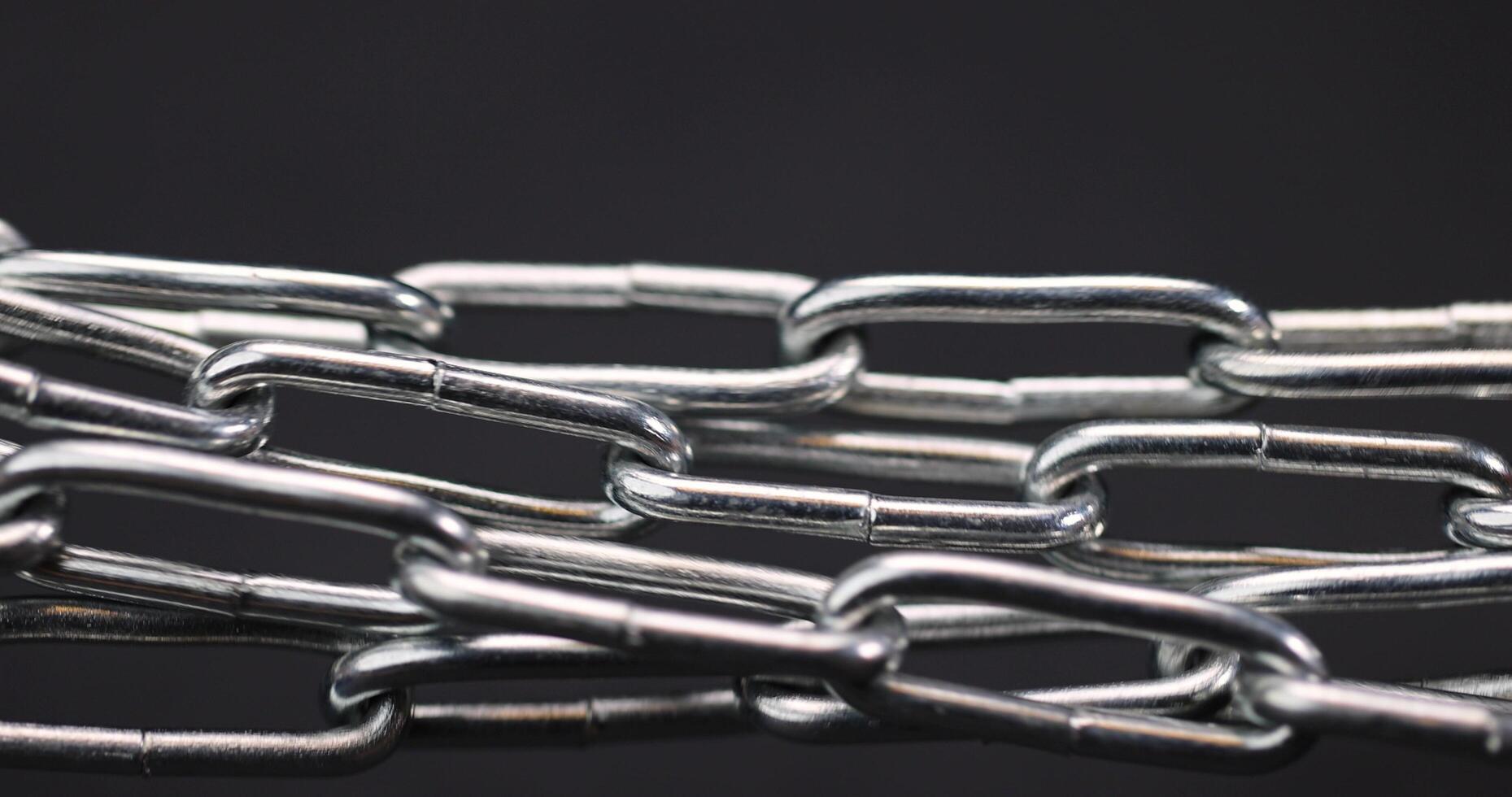 silver steel chain on a black background photo